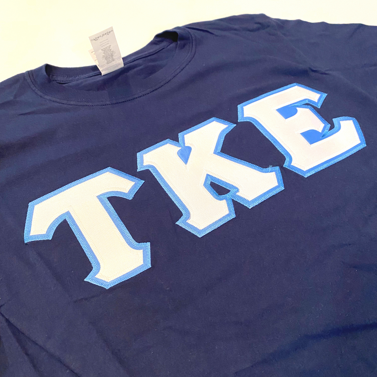 Tau Kappa Epsilon Stitched Letter T-Shirt | Navy | White with Carolina Blue Border