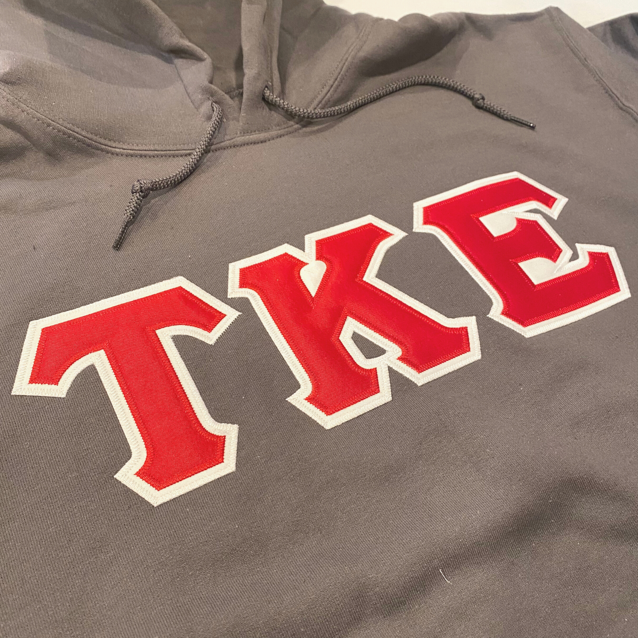 Tau Kappa Epsilon Stitched Letter Hoodie | Charcoal | Red with White Border