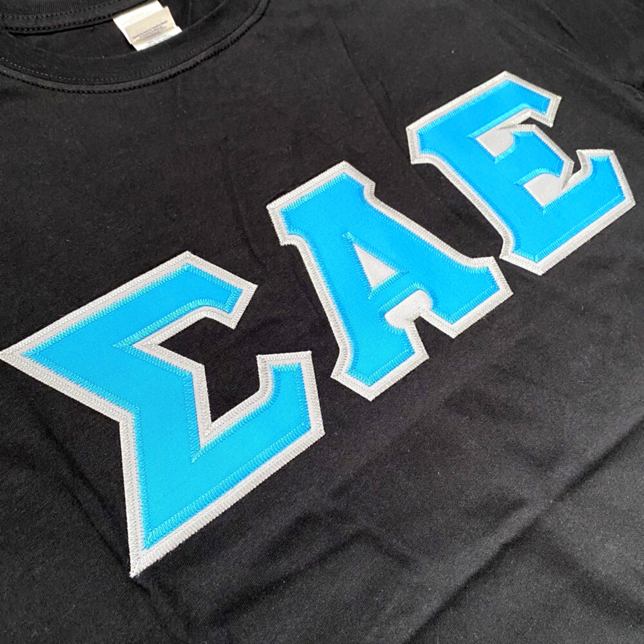 Sigma Alpha Epsilon Stitched Letter T-Shirt | Black | Cyan with Gray Border