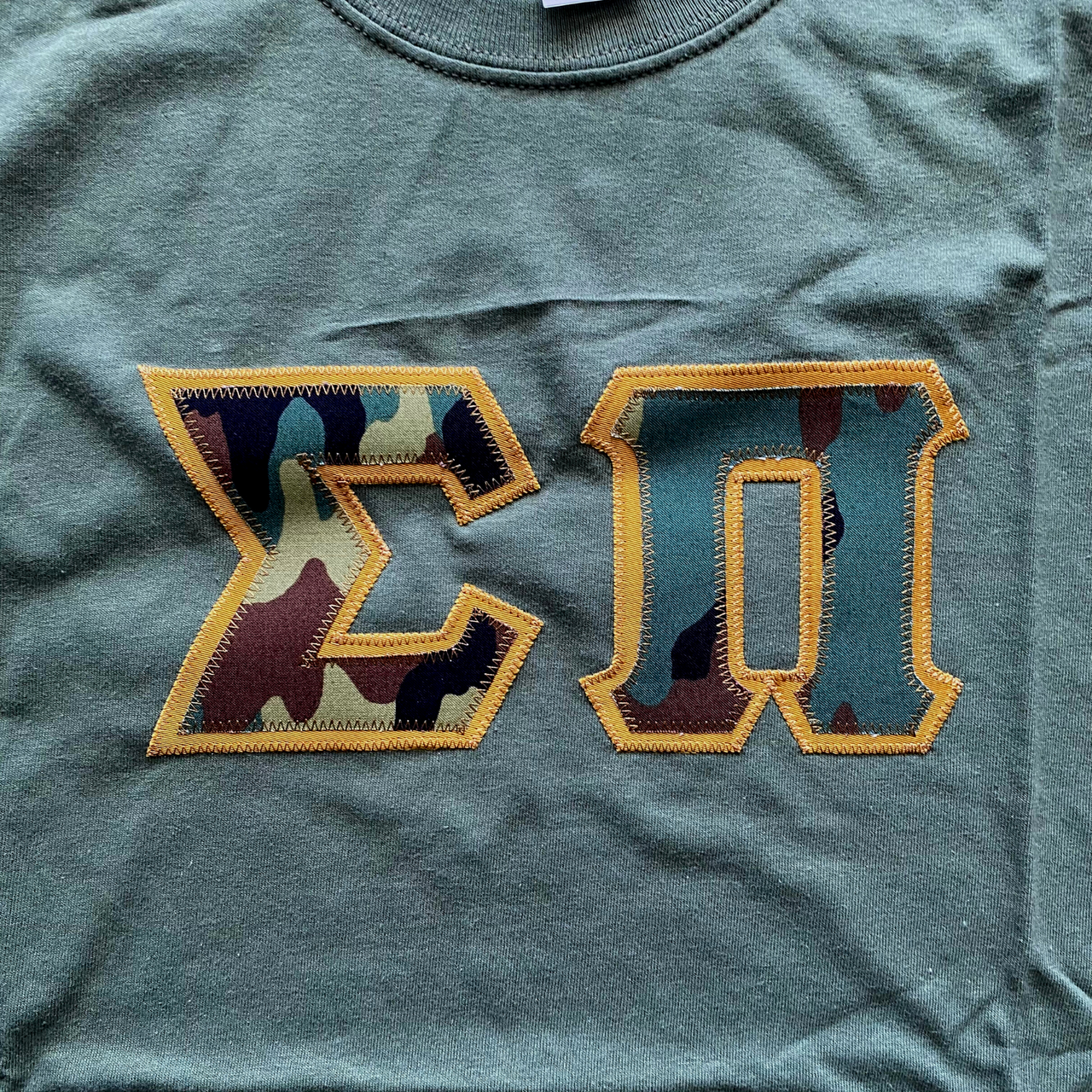 Sigma Pi Stitched Letter T-Shirt | Camo with a Tan Border