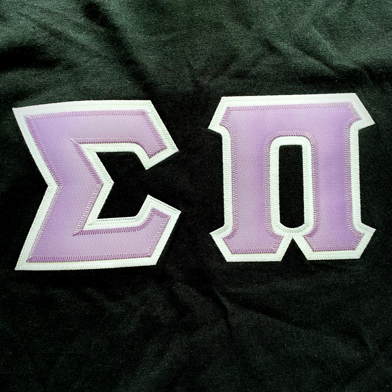 Sigma Pi Stitched Letter T-Shirt | Lavender Letters with a White Border