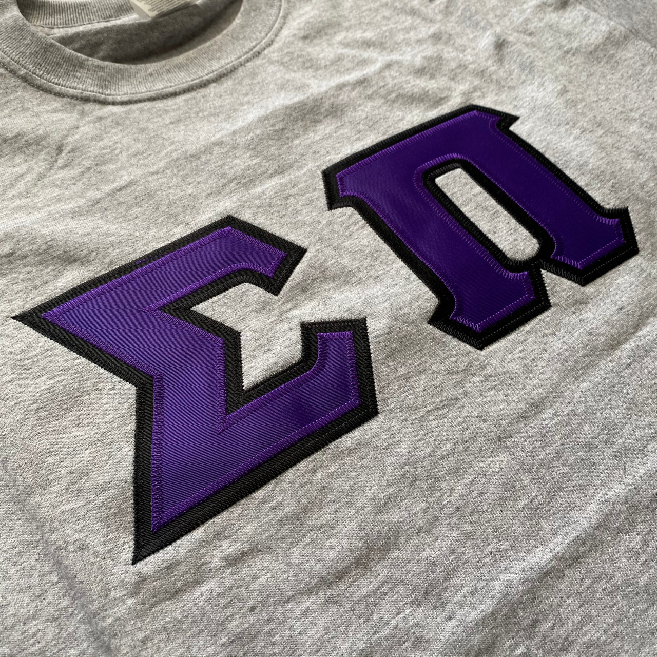 Sigma Pi Stitched Letter T-Shirt | Purple with Black Border