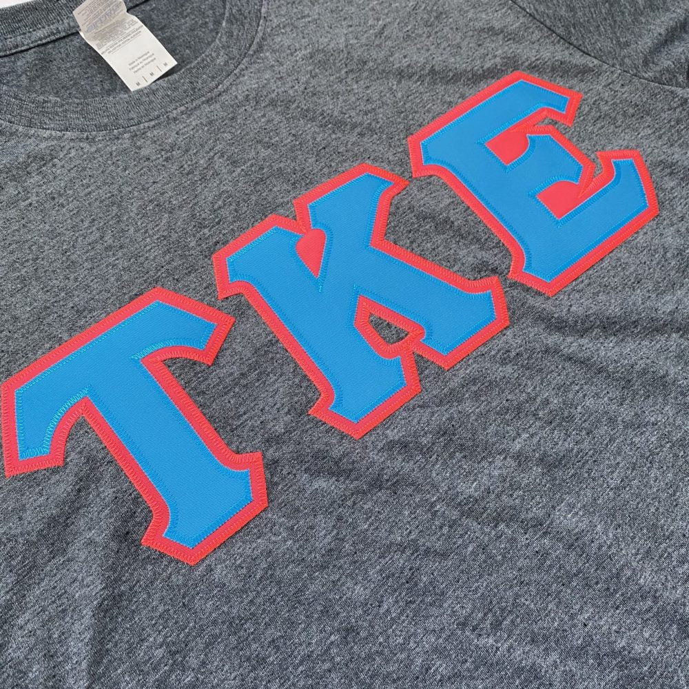 Tau Kappa Epsilon Stitched Letter T-Shirt | Dark Heather | Cyan with Pink Border